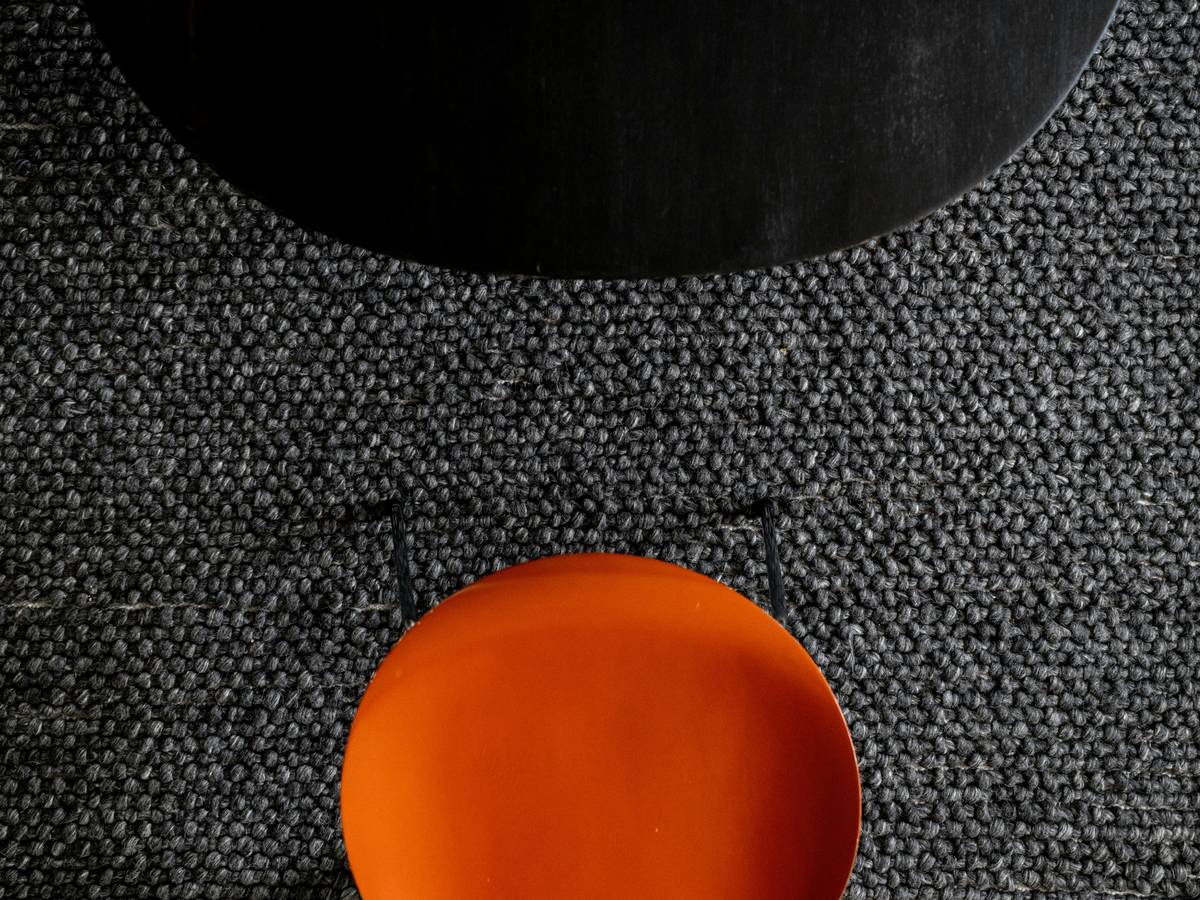 Color psychology chart showing balanced orange and black palettes with white accents for graduation parties, avoiding Halloween associations