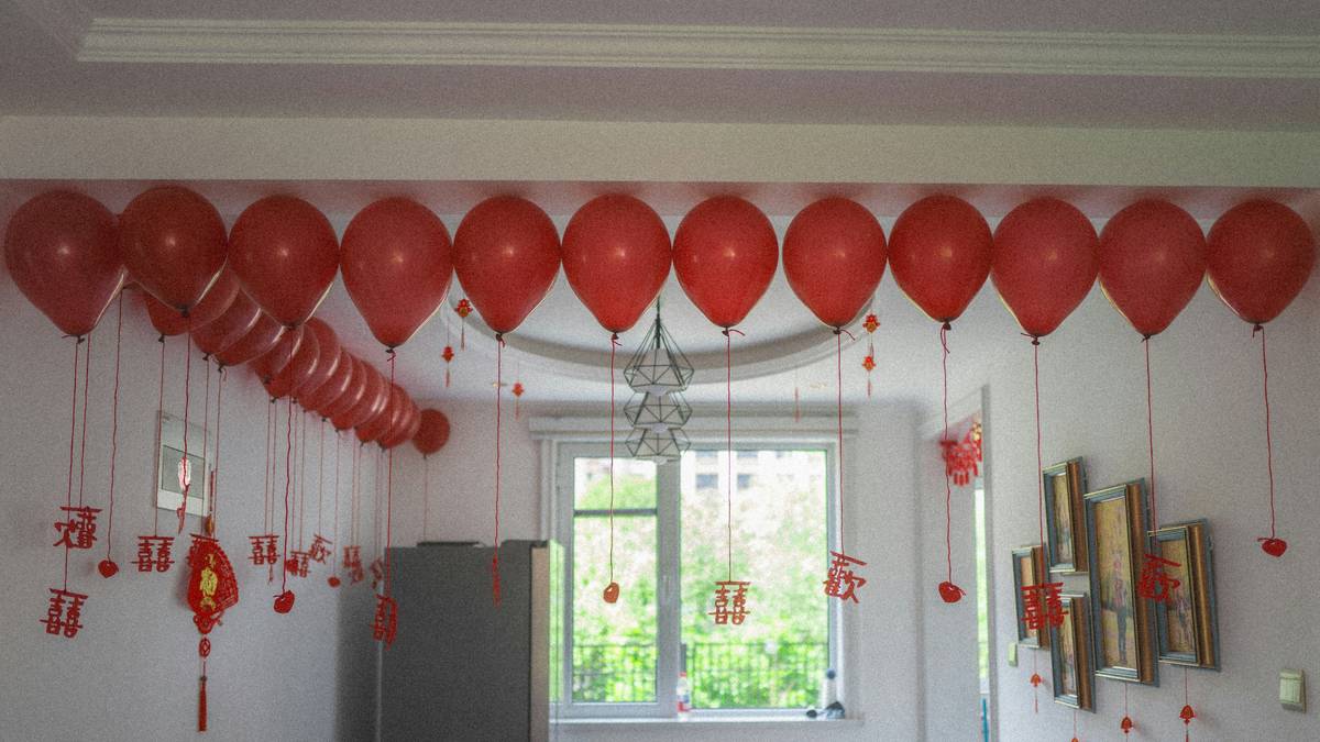 DIY graduation day decoration ideas featuring a personalized timeline wall with photos and mementos